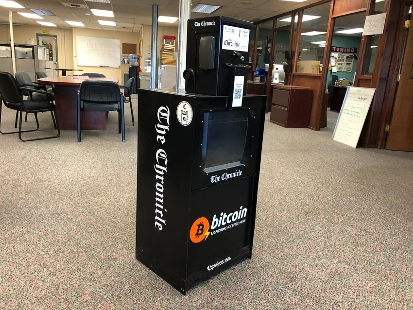 The Chronicle now has a newspaper rack that accepts Bitcoin. It&rsquo;s pictured here in The Chronicle&rsquo;s newsroom, though it is now in service at 153 NW State Ave. in Chehalis.