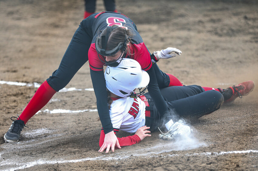Toledo's Quyn Norberg slides into home plate safely against Mossyrock during a softball jamboree in Mossyrock on March 9.