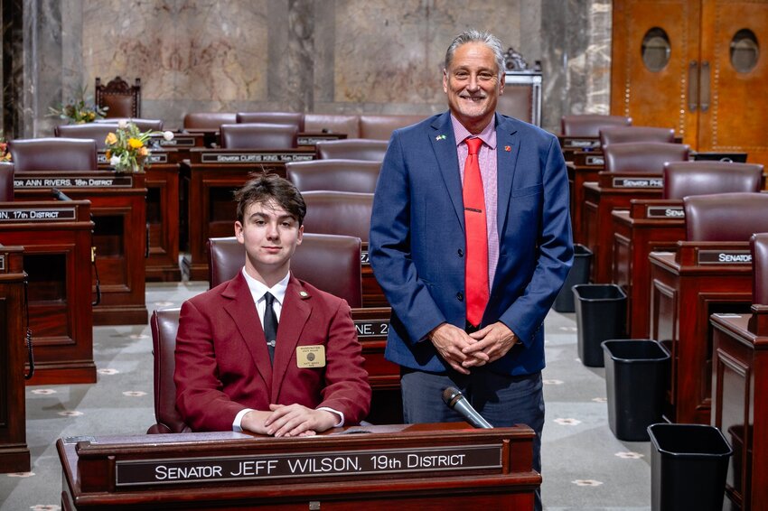 Oakville teen Collin Pearson, a 10th grader at Elma High School, poses for a photo with 19th District lawmaker Sen. Jeff Wilson, R-Longview.