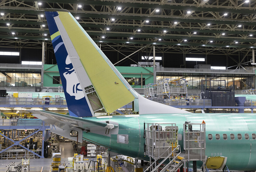 Boeing employees work on the 737 MAX on the final assembly line at Boeing's Renton plant, June 15, 2022, in Washington. (Ellen M. Banner/The Seattle Times/TNS)