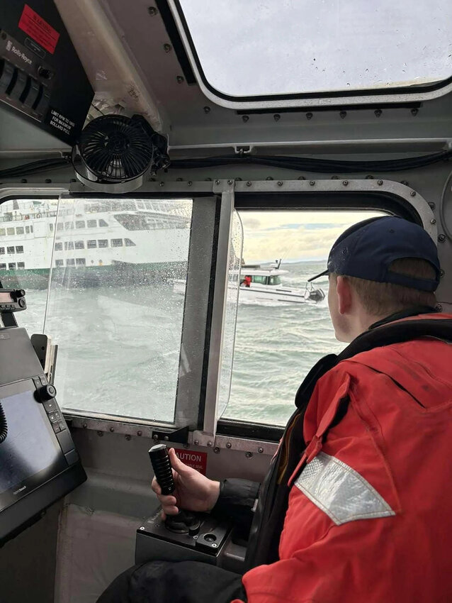 A ferry crew and the Coast Guard rescued six people and two dogs from a damaged boat in Rosario Strait on Saturday, March 9, 2024. (U.S. Coast Guard/TNS)