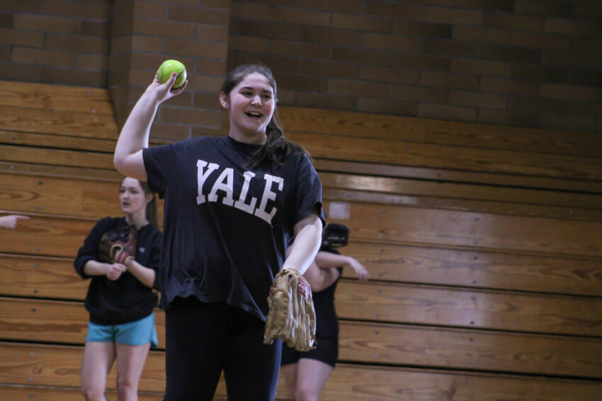 Lucy Wolfe smiles as she fields a ground ball during practice on March 5.