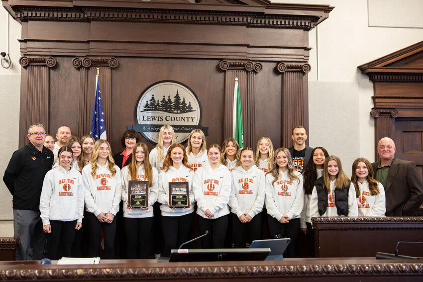 The Napavine girls basketball team poses with the Lewis County commissioners at the Lewis County Courthouse in Chehalis on Tuesday, March 12.