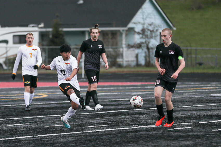 Alfonso Barragan boots the ball upfield during United's win over Tenino on Mar. 12.