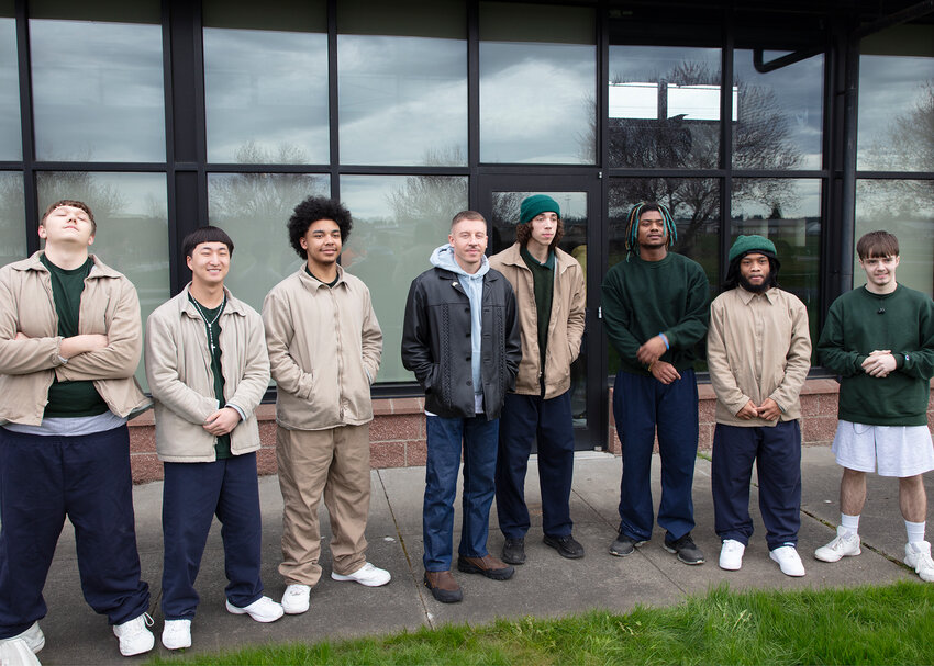 Macklemore, center, stands with Green Hill School residents Ron, Diante, Justin, Blake, Connor and TJ during a visit to the Chehalis juvenile rehabilitation facility on Friday, March 8.