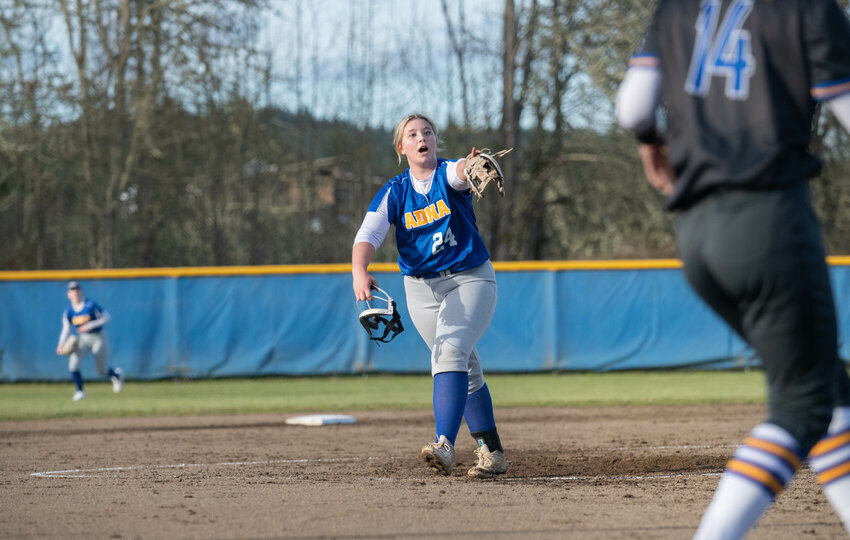 Ava Simms points at her catcher after throwing the game ending pitch during Adna&rsquo;s 2-0 win over Rochester on Wednesday March 13. At Adna high school.