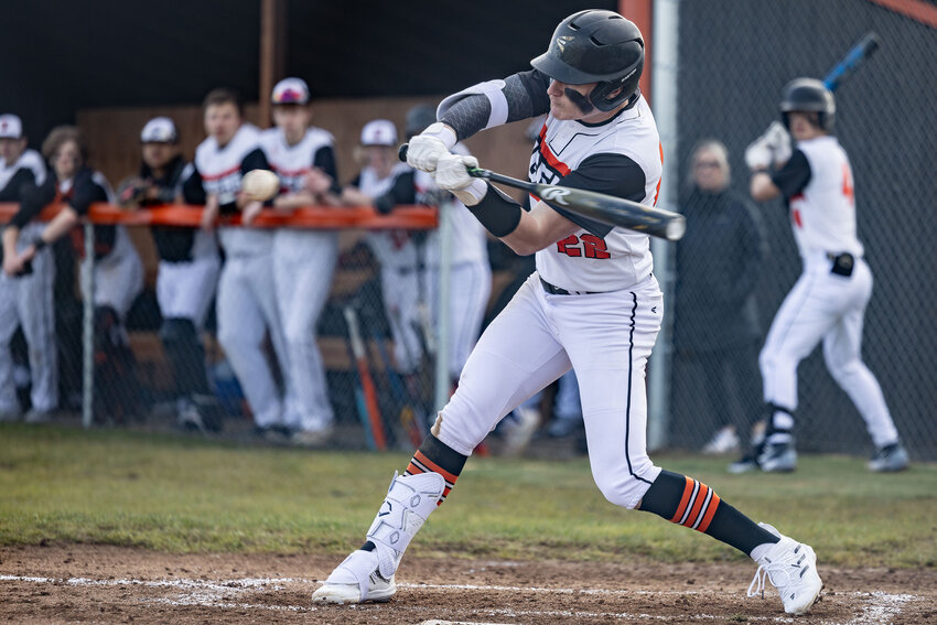 Napavine's Conner Holmes (22) hits the ball during baseball game at Napavine High School on Wednesday, March 13.