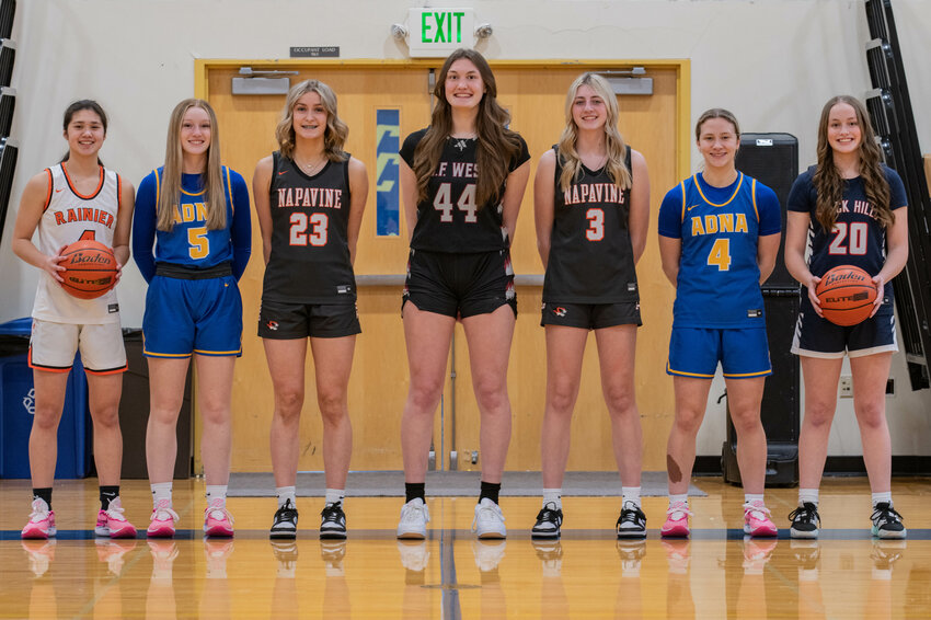 The Chronicle All-Area girls basketball team from left, Angelica Askey, Gaby Guard, Keira O'Neill, Julia Dalan, Hayden Kaut, Karsyn Freeman, and Tyler Venable smile for a photo at Centralia College on March 11.