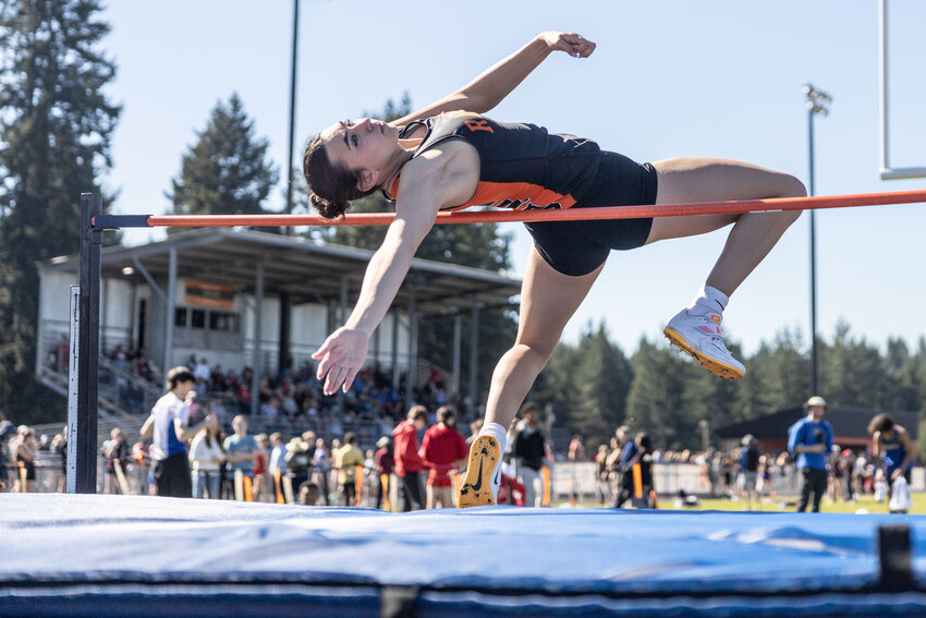 Acacia Murphy competes in the high jump during the Icebreaker meet at Rainier high school on Saturday, March 16.