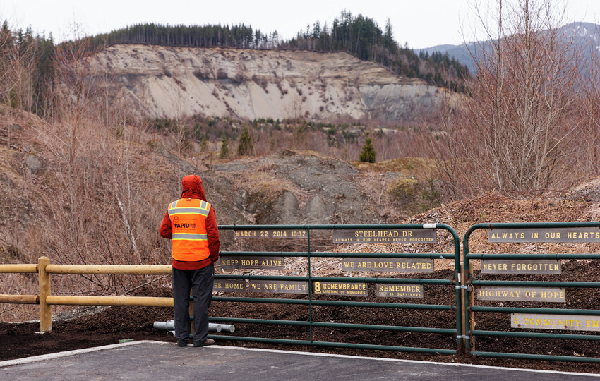 Michael Grilliot, senior research scientist and operations manager watches a drone flying over the Oso landslide are as part of the Natural Hazards Engineering Research Infrastructure (NHERI) RAPID Facility, funded by the National Science Foundation, Friday March 8, 2024. The team was scouting in preparation of a &quot;production&quot; LiDAR drone flight scheduled for the following week, designed to monitor the landslide's changes.