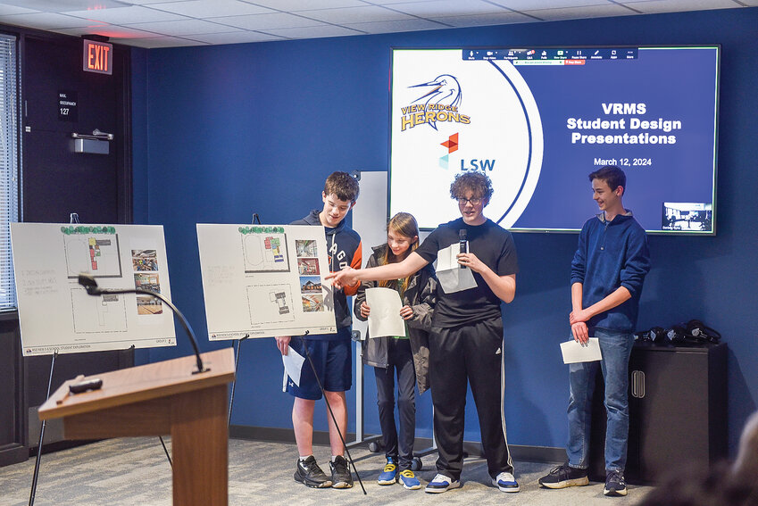 View Ridge Middle School student Logan Watt presents concepts, including ceiling designs to incorporate natural light in the commons of a new middle school.