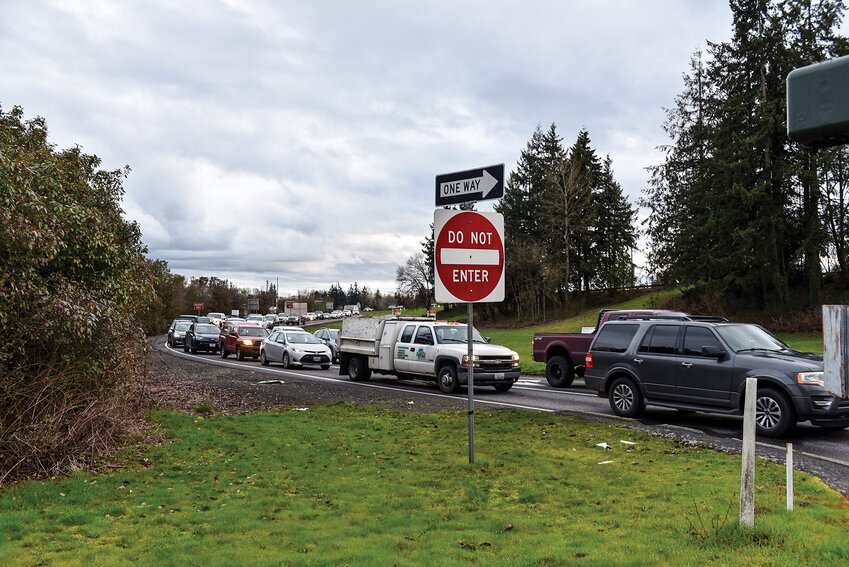 photo by Norman Helgason  Exit 21&rsquo;s interchange is backed up during rush hour in Woodland. A project-ready concept for improving the interchange is expected by the end of 2026.
