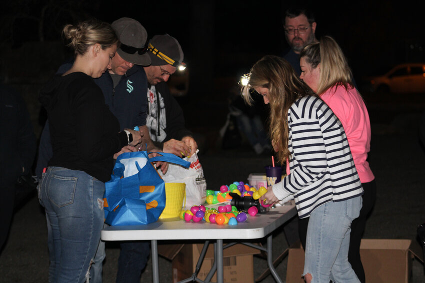 Egg hunters search for prizes in their eggs at Cochrane Park on March 16.