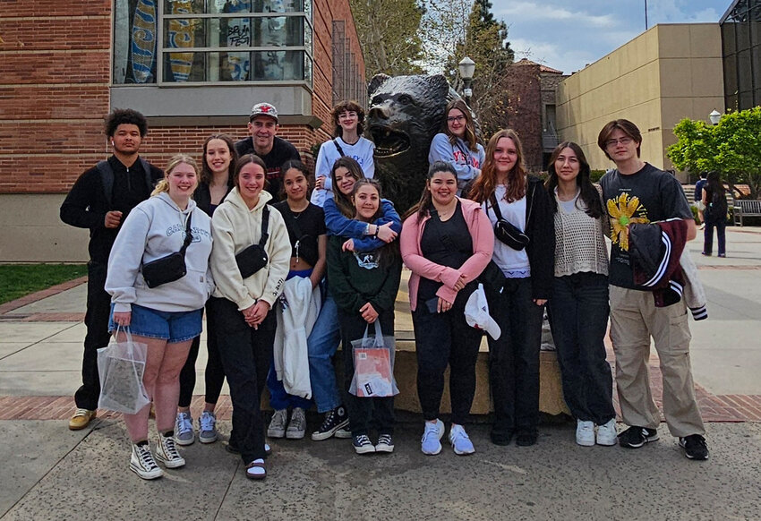 Yelm&rsquo;s sports medicine program poses with UCLA Bruin linebacker and former Tornado football standout Isaiah Patterson while touring campus.
