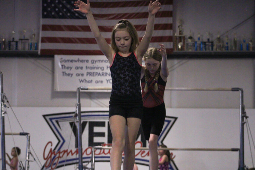 A gymnast with Yelm Gymnastics prepares for a handstand on March 18.