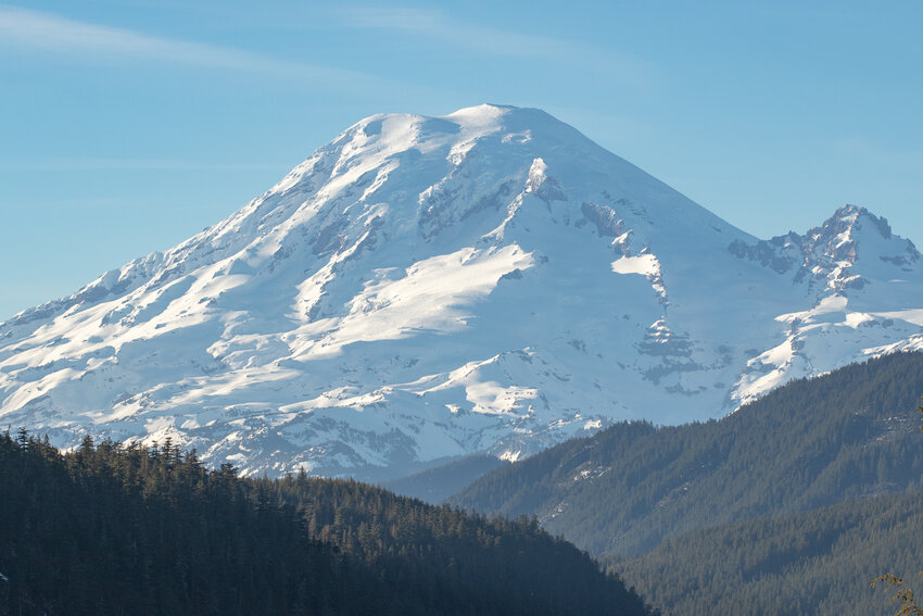 Rocky outcroppings pop out of Mount Rainier's wintery snow blanket as seen from U.S. Highway 12 near the White Pass Ski Area on Saturday, March 16.