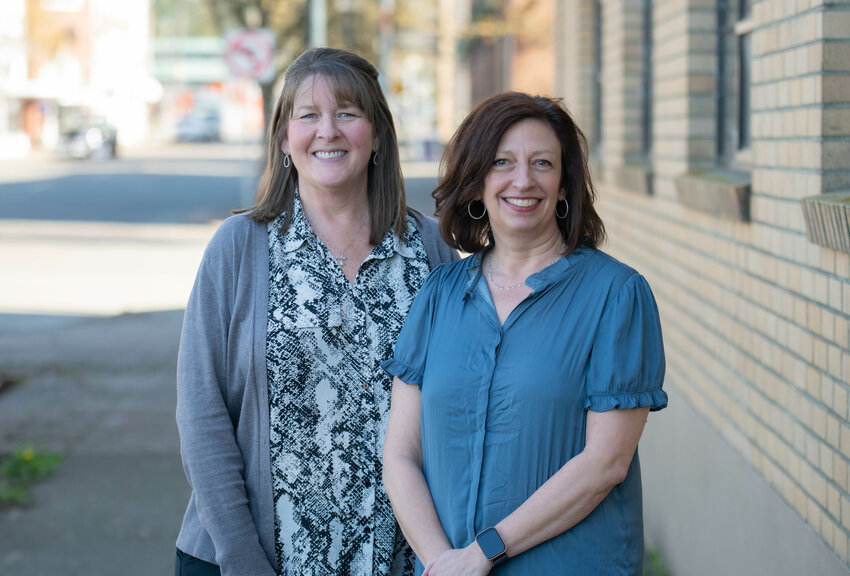 Kim Bradeen and Angie Creel of the Survivors Advocacy Group smile for a photo in Centralia on Monday March 18.