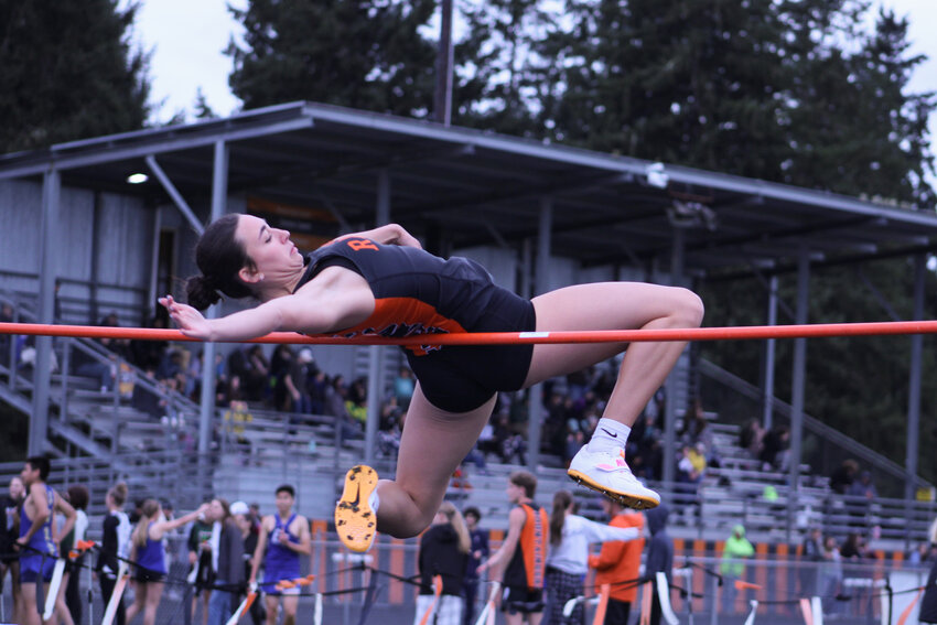 Acacia Murphy attempts the high jump during Rainier's home meet on March 21. Murphy took first with a 4-foot-6-inch leap.