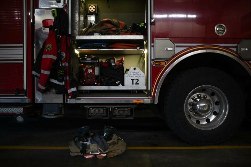 A &quot;turnout&quot; - gear set out to be readily available in the event of a call - rests on the floor near a fire vehicle at Portland Fire &amp; Rescue Station 2 the morning of Mon., Jan. 1, 2024.