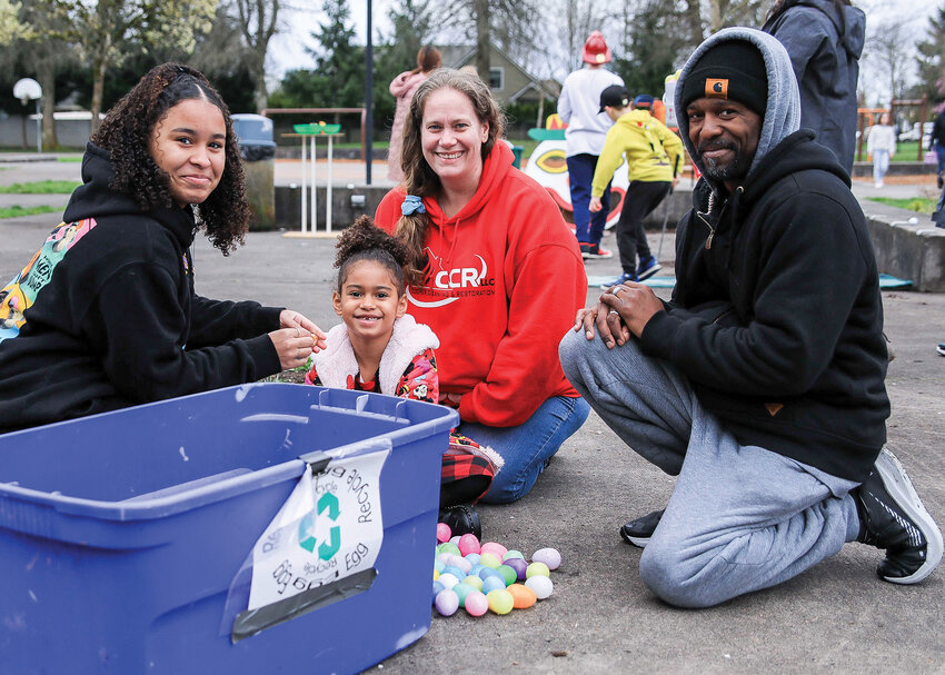A family collects Easter Eggs during the annual hunt at Kiwanis  Park in 2023.