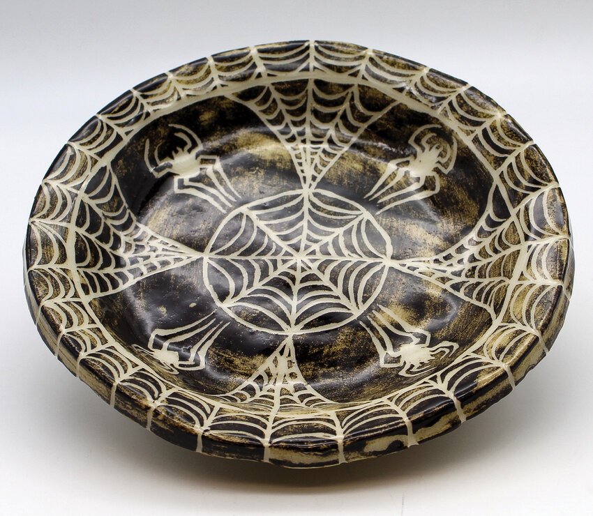 Woodland High School&rsquo;s Lauren Popp&rsquo;s &ldquo;Glass Webbs&rdquo; ceramic bowl is painted with a dark glaze contrasted with stark white spider webs.