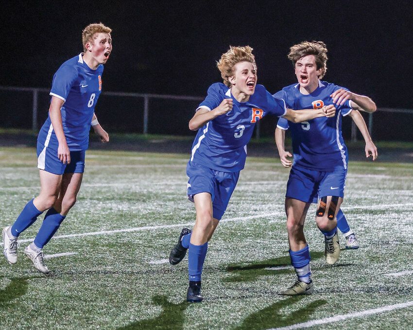 Ridgefield&rsquo;s Grant Platta, No. 3, celebrates a game-winning &ldquo;own goal&rdquo; that he caused to take down the Hockinson Hawks in a 4-3 overtime battle on Thursday, March 21.