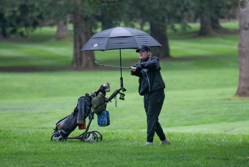 Emily Wilkerson takes a shot during an EvCo girls golf match between Centralia and Rochester at Riverside Golf Course in Chehalis on March 25.