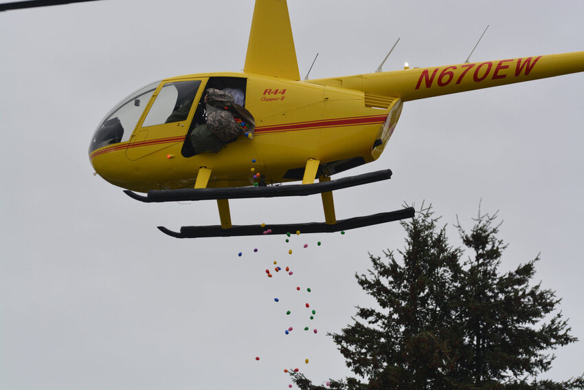 Easter eggs are dropped out of a helicopter onto the veterans field at the American Legion in Yelm in April 2023.