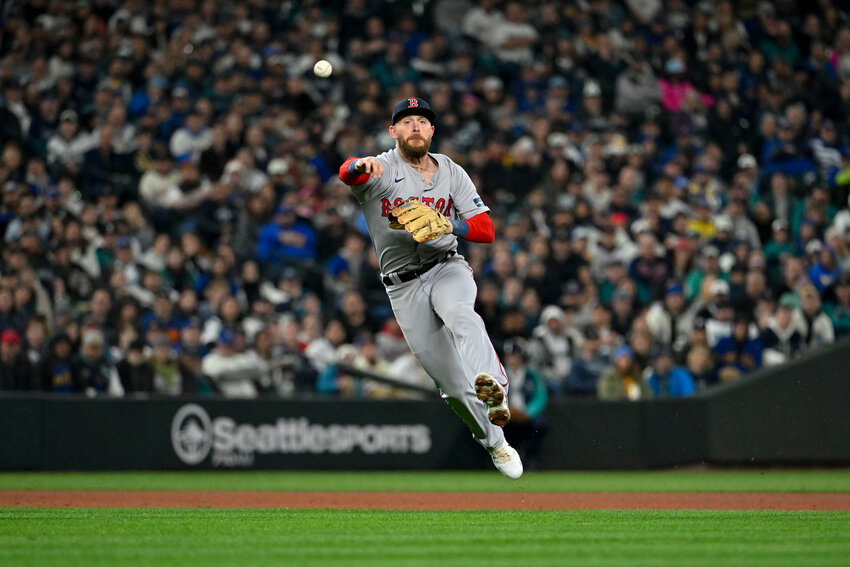 Trevor Story #10 of the Boston Red Sox throws to first base for an out during the third inning of the Opening Day game against the Seattle Mariners at T-Mobile Park on March 28, 2024 in Seattle, Washington. (Photo by Alika Jenner/Getty Images/TNS)