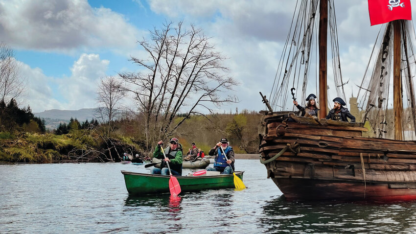 A giant pirate ship sails among Pe Ell River Run paddlers in this AI photo composite illustration.