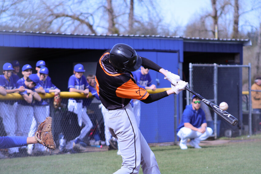 Johnny Boesch puts the barrel on the baseball against Adna on March 29.