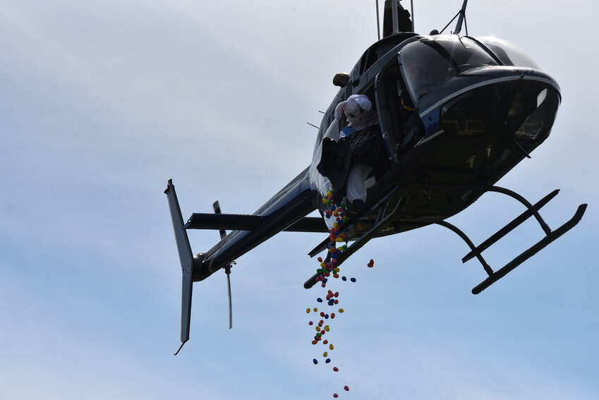 A helicopter drops Easter eggs onto Vets Field at Yelm’s American Legion on Saturday, March 30, to celebrate the holiday.