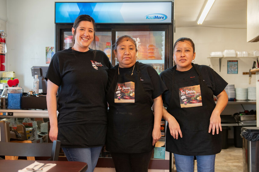 The staff of La Do&ntilde;a Mexican restaurant in Chehalis, From left, Serena Taylor, Petra Guillermo, and Evelina Castro, stand for a photo on Tuesday, April 2.
