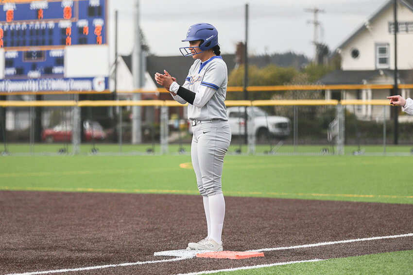 Jimena Luis claps while standing on first after driving in a run during Centralia College's game against Mt. Hood at Bob Peters Field on April 3.