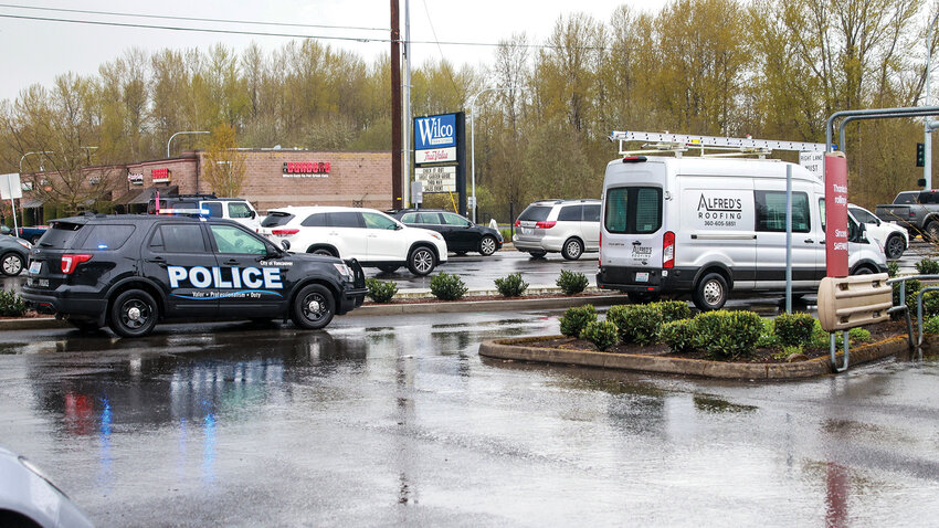 A Vancouver Police Department officer pulls over a work van during a distracted driving patrol emphasis in Battle Ground on Thursday, April 4.