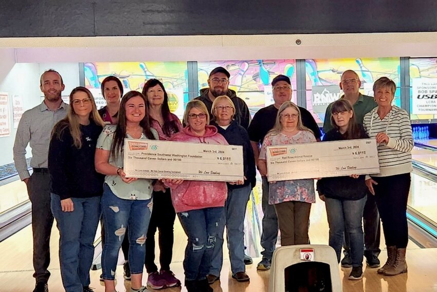 Pictured from left to right are staff from Providence Swedish South Puget Sound, bowling tournaments winners, staff from Red Rose Animal Shelter, and Ron Keller and Barbara Overlin from the Lewis County Bowling Association.