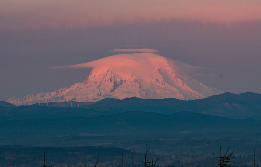 Lenticular clouds appear above Mount Rainier at sunset on Easter Sunday, March 31, as seen from Crego Hill Road in Adna.