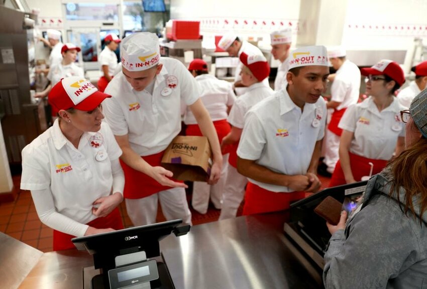 Rainy weather didn't stop eager customers from turning out as In-N-Out Burger opened its third Oregon location, in Keizer, on Thursday, Dec. 12, 2019.