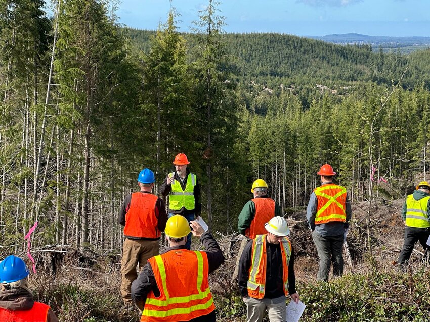 Mark Smalley, an engineer for Rayonier, leads a field trip April 5 as part of the Washington State Society of American Foresters&rsquo; annual meeting, which took place at Grays Harbor College.