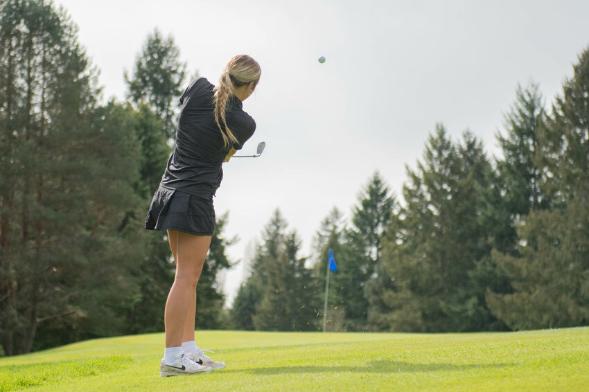 W.F. West's Macee Shannon chips on to the green during a girls golf match between Rochester and W.F. West at Newaukum Golf Course in Chehalis on Wednesday April 10.