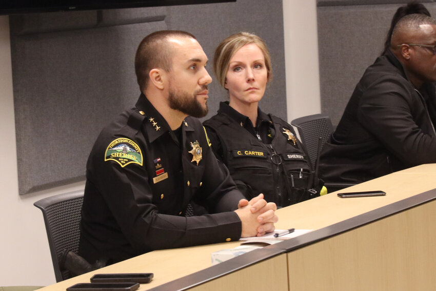 Thurston County Sheriff Derek Sanders listens to public testimony during a forum at the Atrium in Olympia on Thursday, April 11.