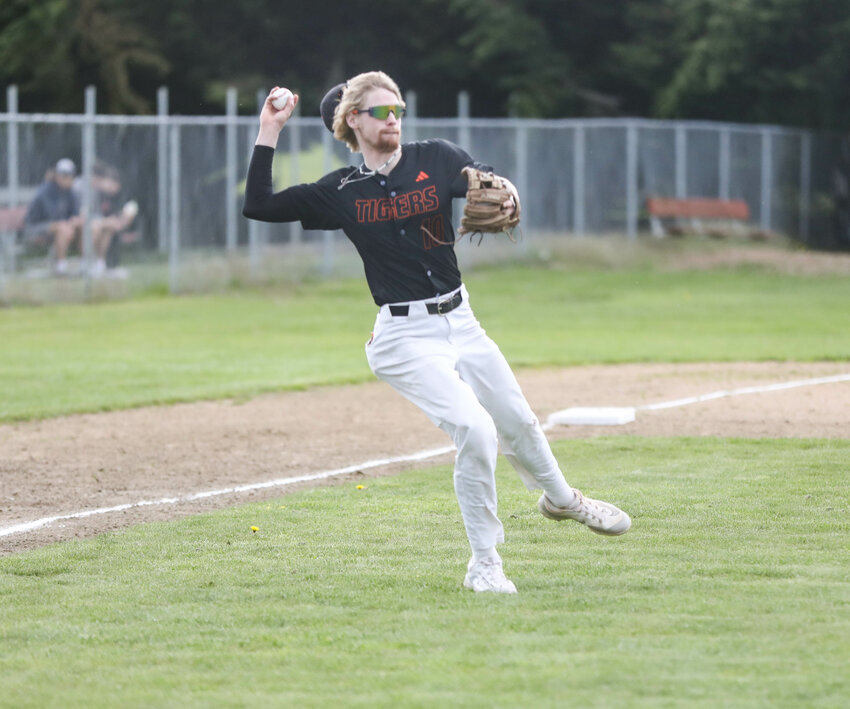 Centralia's Landen Jenkins throws a groundball to first base against Black Hills in an Evergreen Conference game on April 16 in Tumwater.