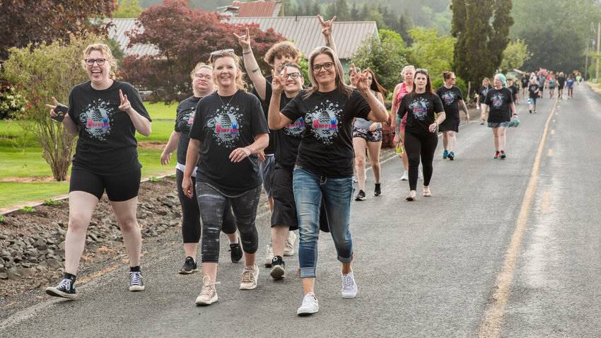 FILE PHOTO &mdash;&nbsp;Participants smile and pose for a photo during the &ldquo;One Step At A Time 5K&rdquo; in Chehalis on Monday, May 15. This event was hosted by the Lewis County Drug Court Foundation and Alumni Association.