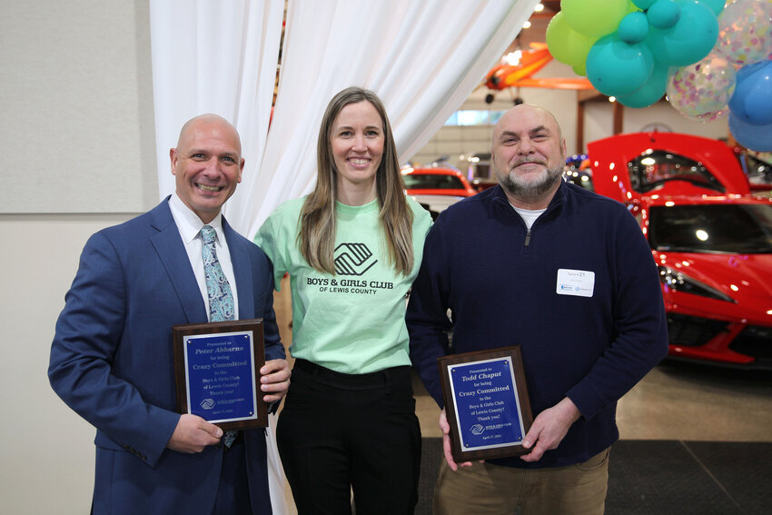 From the left, Rep. Peter Abbarno, Centralia City Councilor and Lewis County Boys and Girls Club Executive Director Sarah Althauser and Todd Chaput of the Economic Alliance of Lewis County pose for a photo during a banquet hosted by The Boys and Girls Club of Lewis County at Jester Auto Museum in Chehalis on Wednesday, April 17.