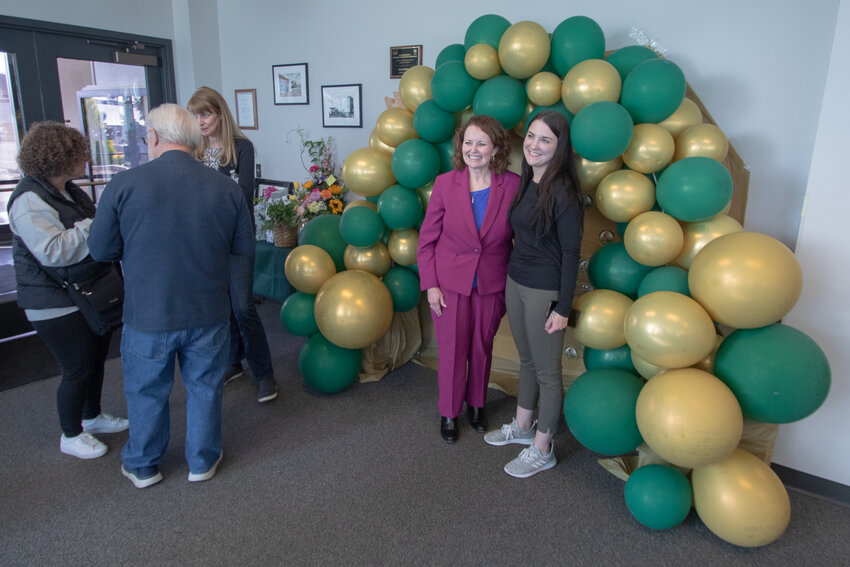 Retiring Chehalis City Manager Jill Anderson, left, poses for a photo during her farewell reception at Chehalis City Hall on Tuesday, April 16.