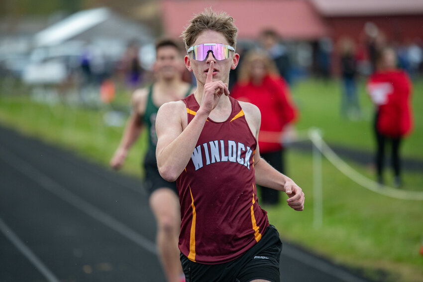 Chase Trodahl celebrates while crossing the finish line to take first place in the boys 1600m race during a 1B/2B track meet at Onalaska High School on Tuesday, April 16.