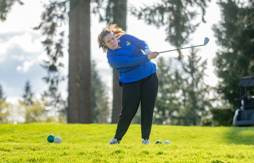 Adna's Kalli Christen tees off during a C2BL golf matchup between Winlock and Adna at Riverside Golf Course in Chehalis on Tuesday March 26.