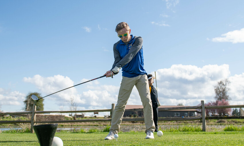 Adna's Nate Scheuber tees off during a C2BL golf matchup between Winlock and Adna at Riverside Golf Course in Chehalis on Tuesday March 26.
