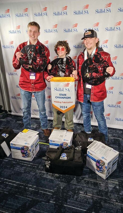 Prairie High School welding students hold their prizes from winning the SkillsUSA competition in Centralia.