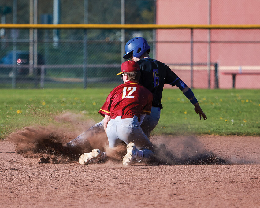 Prairie&rsquo;s shortstop Nolan Nunn tags a runner out at second base after he was caught stealing during the Falcons&rsquo; 11-8 loss to Kelso High School on Thursday, April 18.